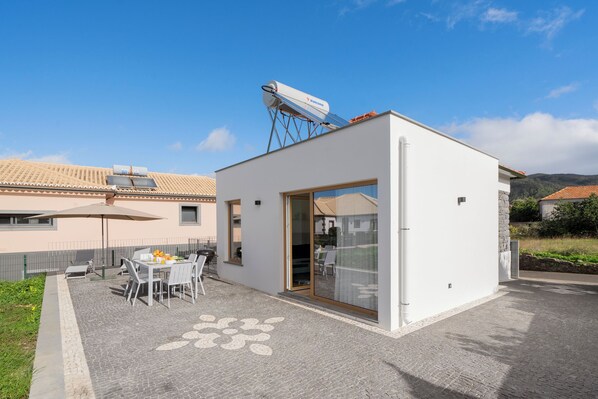 The Front Terrace And Outdoor Dining Area Of Chalet Prazeres By Ourmadeira