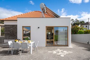 The Front Terrace And Outdoor Dining Area Of Chalet Prazeres By Ourmadeira Villa In Madeira