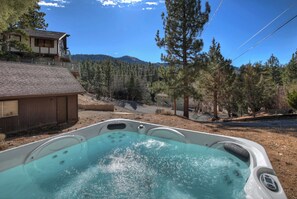 Bask in bubbling bliss in the private hot tub!