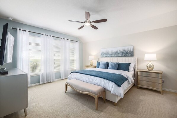 The master bedroom has a comfortable king-sized bed.