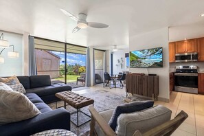 Enjoy seamless living! Our combined living room and full kitchen area offer comfort and convenience for your ideal vacation experience.