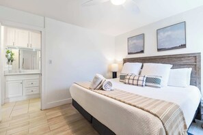 Drift to sleep in this serene bedroom retreat. Comfy bed, modern fan & ample closet space for a truly relaxing and unforgettable stay!