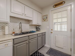 Step through the back door to enjoy the back yard.