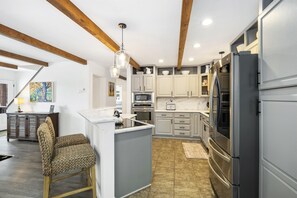 The open-plan kitchen allows for easy mingling and conversation 