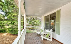 Cozy Adirondack chairs in front porch