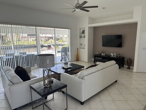 Relax in style with sun-soaked canal views from your airy living space