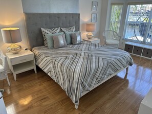 Drift into restful nights in this serene and stylish primary suite