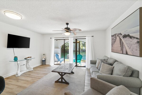 The living room looks out over the water. 