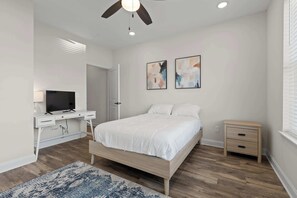 Queen bedroom with a TV