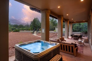 Hot Tub on the patio with the new pool is the background.