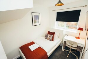 Your cosy sanctuary, complete with comfortable bedding and thoughtful decor