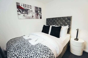 Relax in timeless elegance – this bedroom offers traditional charm and ultimate comfort
