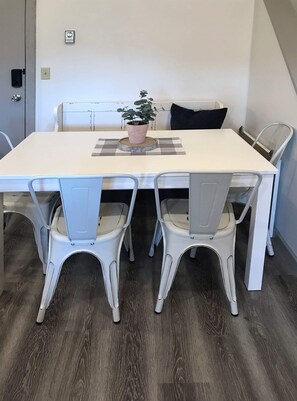 There is seating for 6 at the dining table and room for 2 more at the kitchen counter.