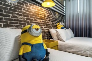 Delight in this playful themed room with cozy twin beds and charming decor, perfect for a fun family getaway.
