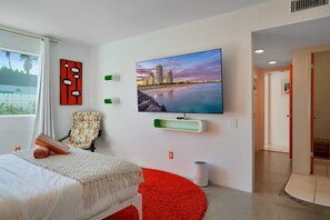 Bedroom 1 with queen bed, Smart TV, and ensuite