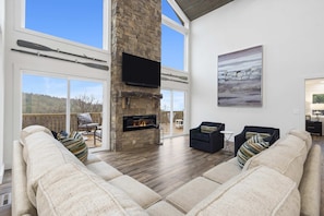 Curl up by the living room fireplace & stream your favorites on the smart TV