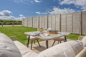 Kingfishers Cove, Titchwell: Enclosed garden with outdoor furniture