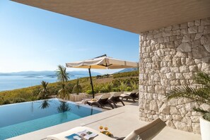 Patio with infinity heated pool, private garden, sun loungers and sea view in Luxury Rental Villa Energy Orebic - Peljesac 
