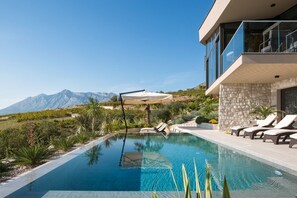 Patio with infinity heated pool, private garden, sun loungers and sea view in Luxury Rental Villa Energy Orebic - Peljesac 