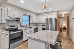 Kitchen with island and main-level bedroom