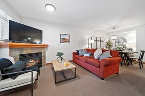 Cozy living room with gas fireplace, Smart TV with Netflix, and Cable access.