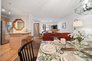 The open-concept dining area seamlessly flows into the spacious living area.