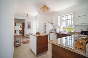 Enjoy cooking in this kitchen with bright lighting and an open layout