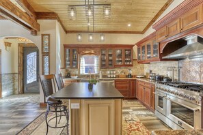 Chefs dream in this fully loaded gourmet kitchen w/ eat in bar