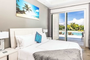 Wake up to pool views and sunshine in this serene, stylish bedroom retreat.