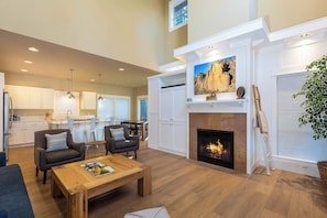 The living room and kitchen are connected in one big open space.