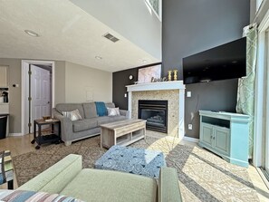 Living room with smart TV and seasonal fireplace