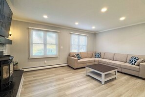 living room with high hats and baseboard heat
