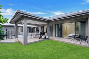 A grassy backyard provides ample space for the kids to play or to lay out and soak up the sunshine.