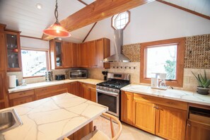 Spacious kitchen with atttached sitting porch.  