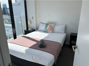 Bedroom 1, Queen bed, En-suite bathroom, Balcony with Sky tower view