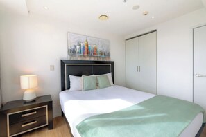 Bedroom 1, King bed, Wardrobe, Black-out blinds, Nightstand.