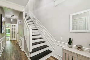 Stairs lead up to the main living area.