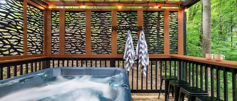 Relax in the Hot Tub with a View of the Peaceful Surrounding Forest.
