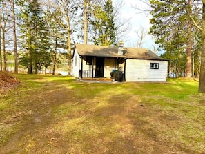 There is a spacious yard as you enter the cabin.