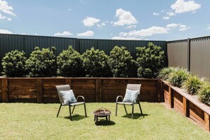 Gather around the cosy firepit in the beautifully landscaped backyard – ideal for cool evenings under the stars.