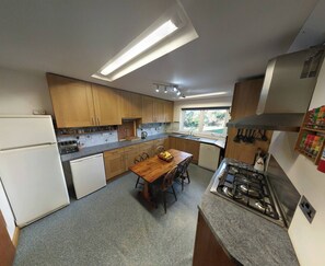 Kitchen. Now has a larger fridge, twin ovens, 6 ring hob + twin microwaves. 