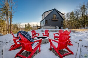 Warm up around our wood-burning fire pit with seating for 8 guests!