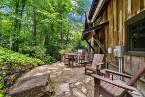 Outdoor patio with gas grill and bistro seating