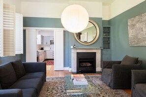 The formal lounge room with a working Jetmaster fireplace and marble surround.