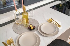 Dining table in the modern open-space kitchen
