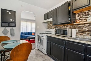 Step into the well-equipped kitchen.