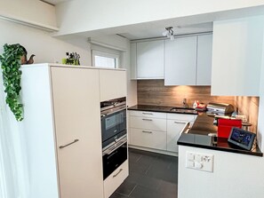 Kitchen Appliance, Kitchen, Countertop, Cabinetry, Major Appliance, Flooring, Interior Design, Wood, Floor, Furniture