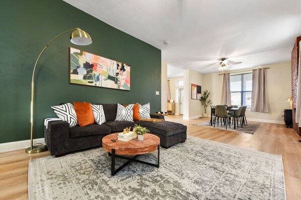 Spacious living and dining area with modern decor, ideal for family time.