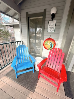 Sip your morning coffee or evening drinks on these colorful Adirondack chairs – the ultimate porch vibes.