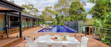 Large solar heated pool with entertaining area